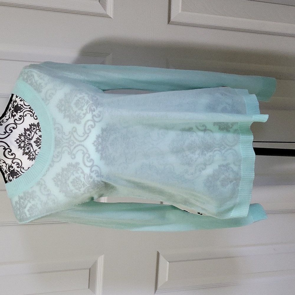 Beautiful sheer Turquoise blue T/O sweater.